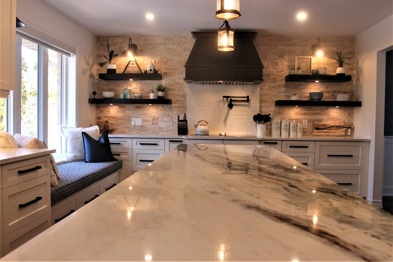 Stone backsplash kitchen with custom range hood